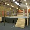 Interior. View of boxing ring in fitness studio.