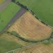 Oblique aerial view centred on the cropmarks of the souterrain, round houses and pits, taken from the E.