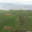 General oblique aerial view centred on the Blows Moss area of South Ronaldsay looking to Caithness, taken from the ENE.