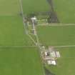 Oblique aerial view centred on the Country House with the Home Farm adjacent, taken from the SW.
