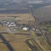 General oblique aerial view centred on the air freight centre with the WW II aircraft hangar adjacent, taken from the ESE.