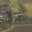 Oblique aerial view centred on the farmhouse with the walled garden and coach house adjacent, taken from the SW.