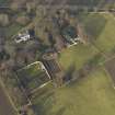 Oblique aerial view centred on the farmhouse with the walled garden and coach house adjacent, taken from the S.