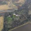 Oblique aerial view centred on the country house with the gardens adjacent, taken from the SW.