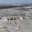 Oblique aerial view of the shale oil works bings, taken from the SW.