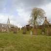 View looking NE across graveyard of Dalton Old Parish Church, showing the ruinous 18th century church in relation to its late-19th century successor