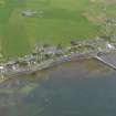 Oblique aerial view centred on the village with the pier adjacent, taken from the SW.