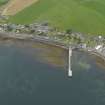 Oblique aerial view centred on the village with the pier adjacent, taken from the SSE.