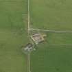 Oblique aerial view centred on the farmhouse with the farmstead adjacent, taken from the NNE.