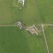 Oblique aerial view centred on the farmhouse with the farmstead adjacent, taken from the NW.