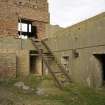 Detail of courtyard below the gun emplacement showing access steps to gun pit from SSW.