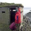 View of blockhouse from NNW and RCAHMS at work.