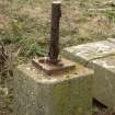 Detail of small concrete pillar with metal fixing.