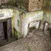 Detail of magazine exit to rear of gun pit in M group gun emplacement with ready use ammunition lockers.