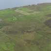 General oblique aerial view of the remains of the farmsteads around the Burn of Goustrie on Rousay, taken from the WNW.