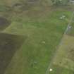 General oblique aerial view of the remains of the farmsteads around Kingarly on Rousay, taken from the SSE.