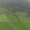 General oblique aerial view of the remains of the farmsteads and fields at Castlehill on Rousay, taken from the NNW.