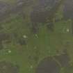 Oblique aerial view centred on the remains of the farmsteads, field systems and head dykes, taken from the SW.