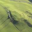 Oblique aerial view centred on the remains of the fort, taken from the NW.