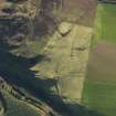 Oblique aerial view centred on the remains of the dun, field banks and rig at Balnagleck Farm on the Mull of Kintyre, taken from the NNW.