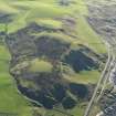 General oblique aerial view of the remains of the fort and landslips, taken from the NNW.