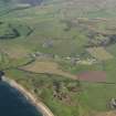 General oblique aerial view looking across the village of Southend, taken from the SE.