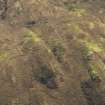 Oblique aerial view of the remains of the farmstead, field banks and rig and furrow, taken from the NNE.