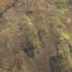 Oblique aerial view of the remains of the farmstead, field banks and rig and furrow, taken from the N.