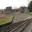 View of the west end of Meadowbank Stadium from the northeast, showing bench seating and dot matrix scoreboard.