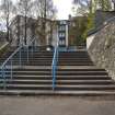 Detailed view of stairway with stone walled embankment at the northwest entrance to Meadowbank Stadium.