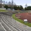 View looking northeast from the west end of Meadowbank Stadium, showing bench seating and track.