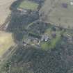Oblique aerial view centred on the country house with the stables adjacent, taken from the NNW.