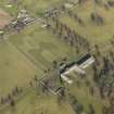 Oblique aerial view centred on the Riding Stables, taken from the SW.