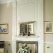 Interior. View of fireplace and decorative mantelpiece