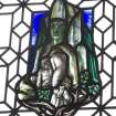 Interior. Detail of stained glass panel in library