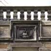 Detail of heraldic panel within wallhead parapet on south east elevation