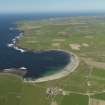 General oblique aerial view of the Bay of Skaill with Skara Brae, Skaill House and farm in the foreground, taken from the S.