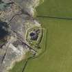 Oblique aerial view centred on Midhowe broch, Rousay, taken from the SE.