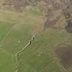 Oblique aerial view centred on the ruined farmsteads of Burness, Castlehill, Turbitail, Upper Burness and Whitemeadows, taken from the SE.