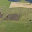 Oblique aerial view centred on the Ring of Brodgar with the cairns adjacent, taken from the NW.