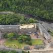 Oblique aerial view of New Lanark centred on the roof garden, taken from the NNE.