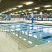 Interior view of Royal Commonwealth Pool, Edinburgh. View looking S across teaching pool.
