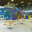 Interior view of Royal Commonwealth Pool, Edinburgh. View of children's soft play area addition to snack bar at NE end of main concourse.