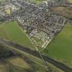 General oblique aerial view of the town with the railway viaduct adjacent , taken from the SE.