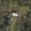 Oblique aerial view centred on the tower/country house with the garden adjacent, taken from the SW.