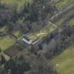 Oblique aerial view centred on the tower/country house with the garden adjacent, taken from the N.