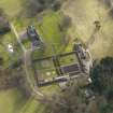 Oblique aerial view centred on the country house with the walled garden, taken from the N.