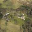Oblique aerial view centred on the country house with the walled garden, taken from the SW.