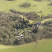Oblique aerial view centred on the country house with the walled garden adjacent, taken from the NNW.