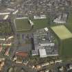Oblique aerial view centred on Linlithgow Academy with the football ground, taken from the SW.